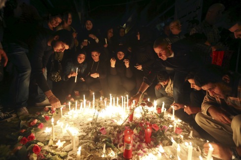 People light candles during a vigil at the site of the two explosions that occurred on Thursday in the southern suburbs of the Lebanese capital Beirut, November 13, 2015. REUTERS/Hasan Shaaban - RTS6U96